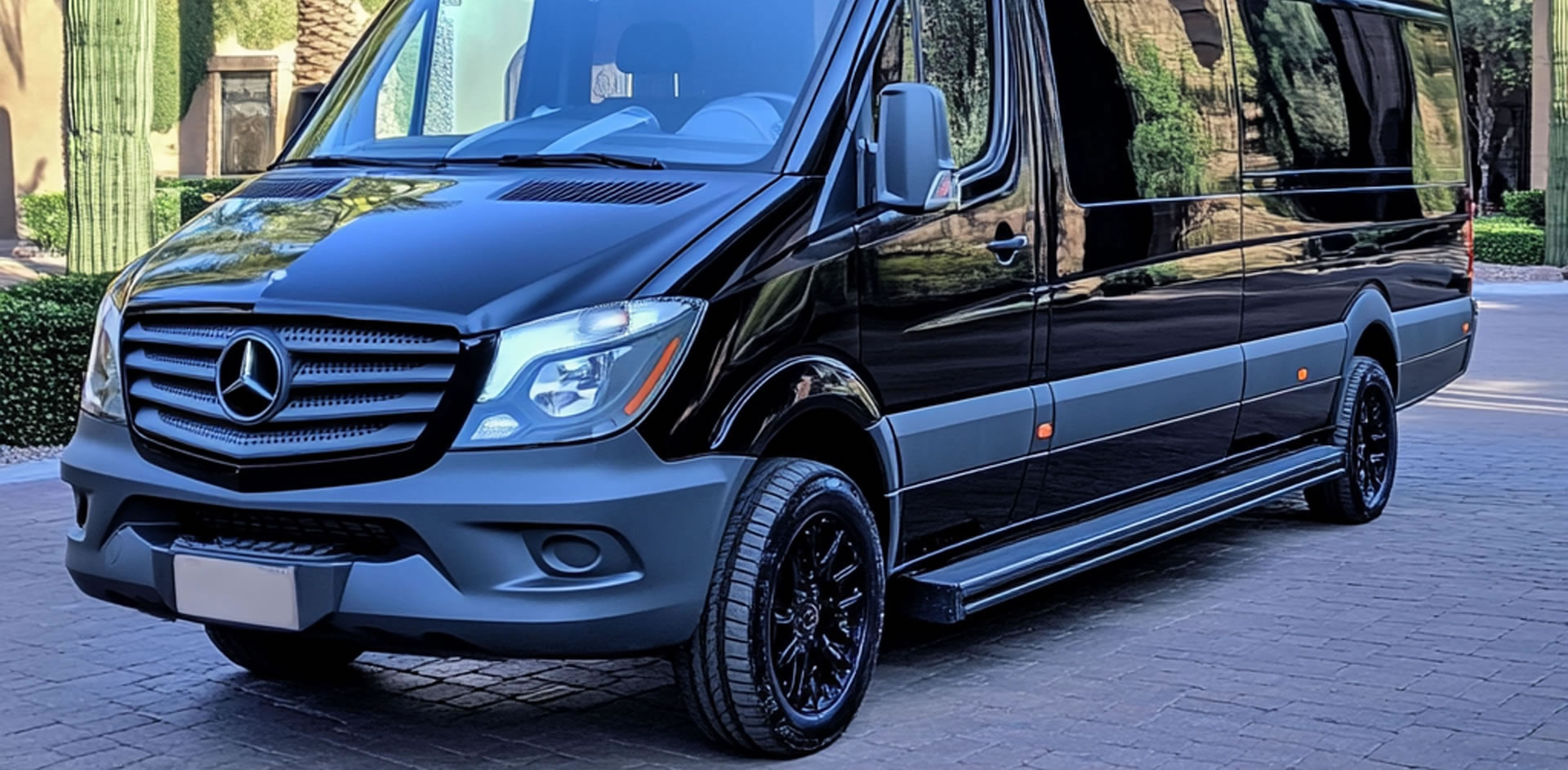 High-quality Mercedes-Benz Sprinter in front of Mediterranean architecture.